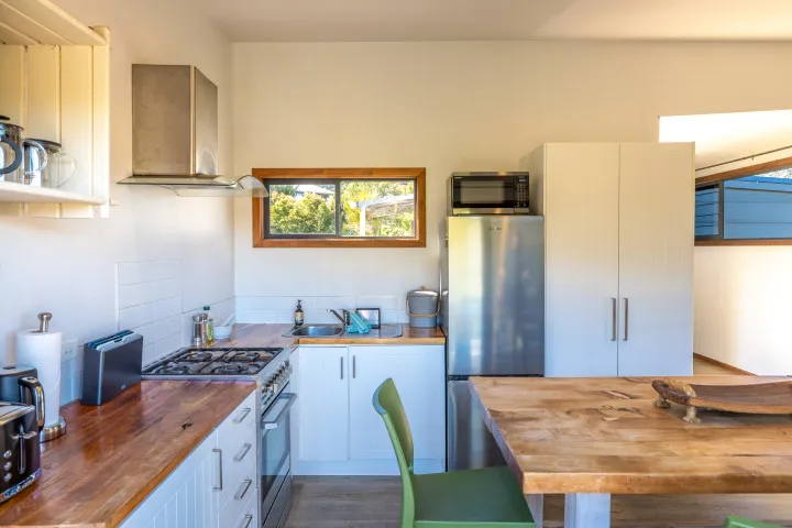 Harvest Cottage Waiheke Island Full kitchen with oven fridge and microwave
