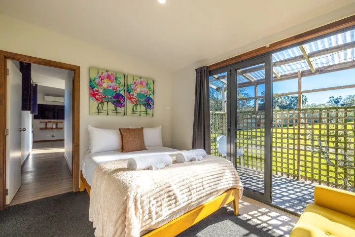 Harvest Cottage Waiheke Island Master bedroom bathed in natural light v2.