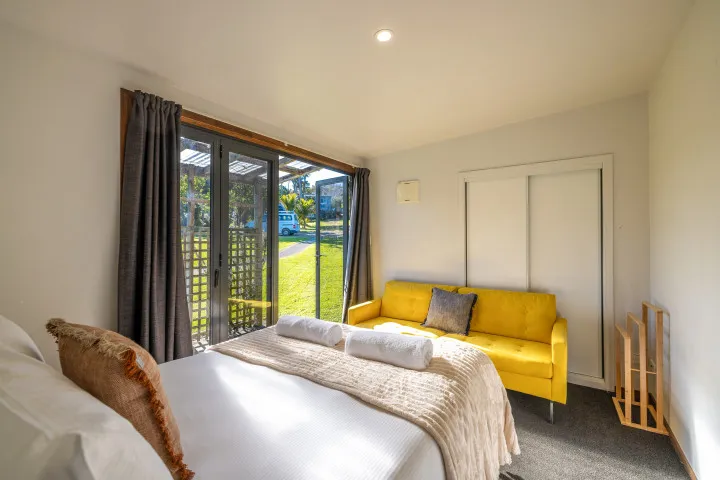 Harvest Cottage Waiheke Island Master bedroom with private entrance