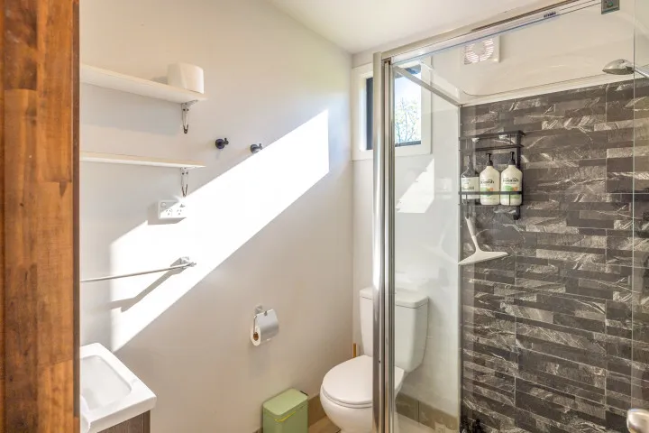 Harvest Cottage Waiheke Island Modern bathroom with shower and toilet
