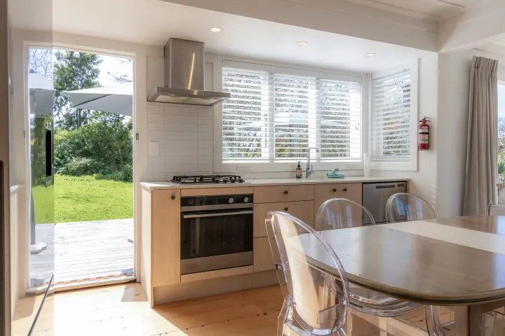 Indoor open plan diningat Tahatai Cottage