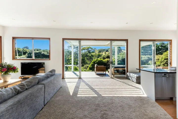 Comfortable lounge and TV room for entertaining family and guests at Karaka Sanctuary