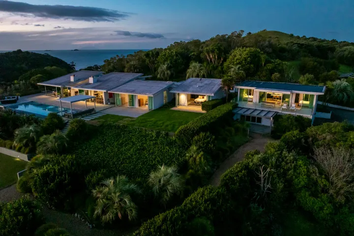 Korora Estate Exterior Back of house showing apartment night