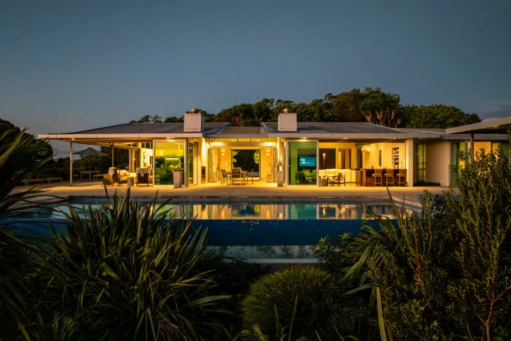 Korora Estate Exterior Looking in over the pool night
