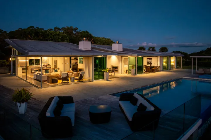 Korora Estate Exterior Looking into the house at night