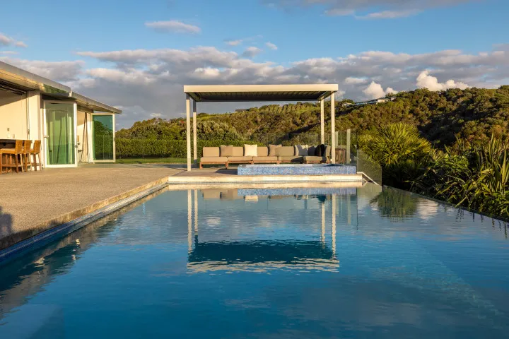 Korora Estate Looking overpool to lounge area dusk