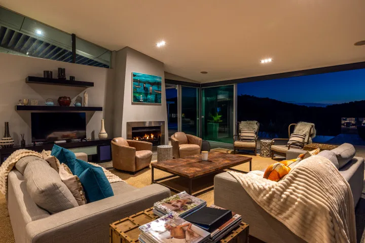 Korora Estate Main lounge at dusk with fireplaces