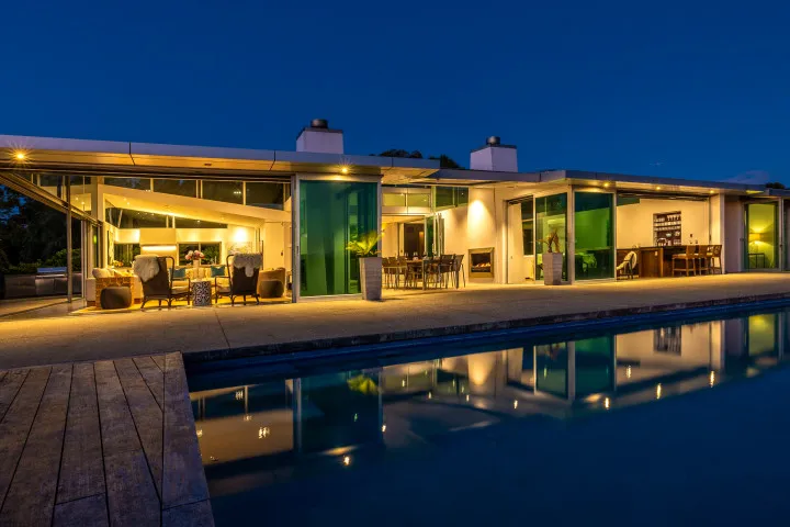 Korora Estate View of pool and house at dusk