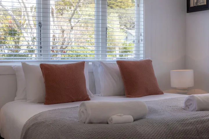 Luxury bedding at Tahatai Cottage