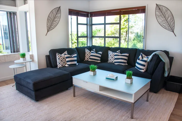 Large comfortable couch and coffee table at Onetangi family apartment