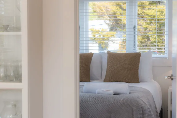 Sneak peak of the bedroom at Tahatai Cottage