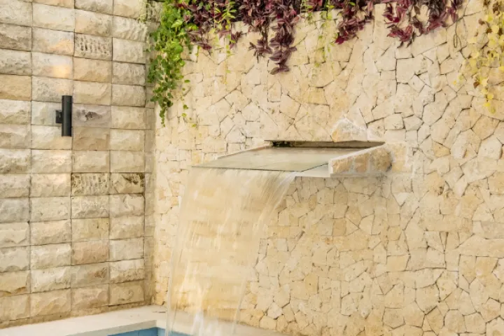 Swarna Mandapa Pool area water feature with cascading waterfall