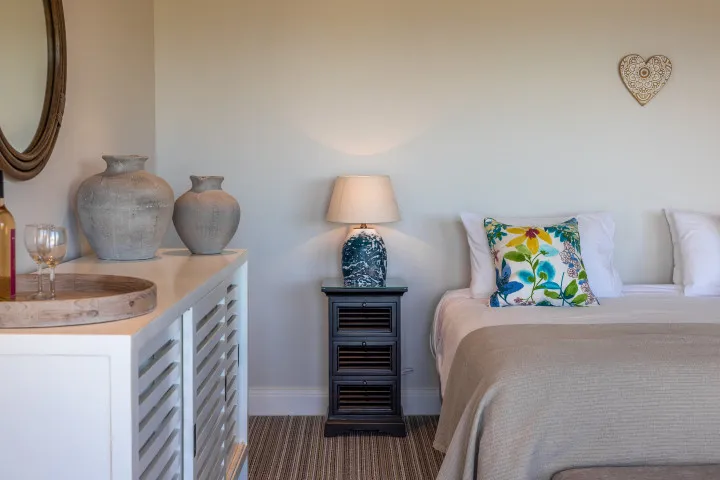 The Keep at Woodside Bay Super king bed luxury linens and decorative details