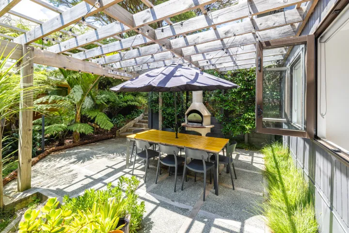 Villa De La Isla Family outdoor dining with fire pit and pizza oven