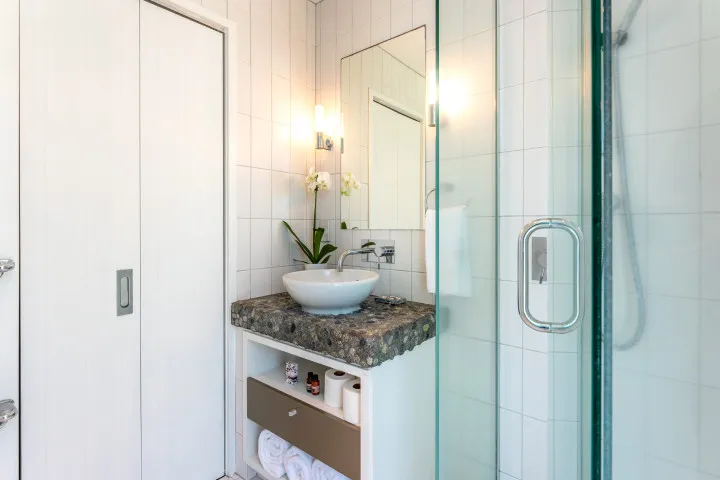Vista On The Beach at The Sands Bathroom vanity laundry area in cupboards