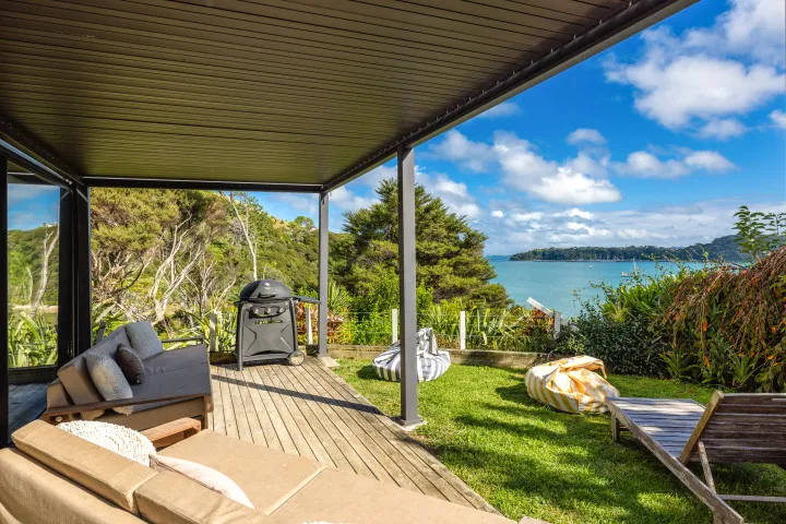 Wharetana Bay Villa BBQ and outdoor lounge area
