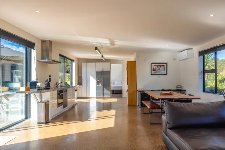 Wharetana Bay Villa Large kitchen and dining area