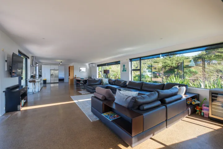 Wharetana Bay Villa Living area with TV
