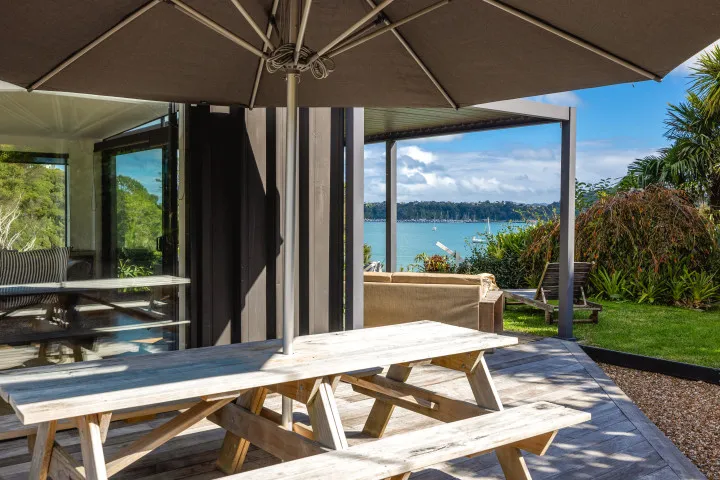 Wharetana Bay Villa Outdoor seating in a number of places to stay in or out of the sun.