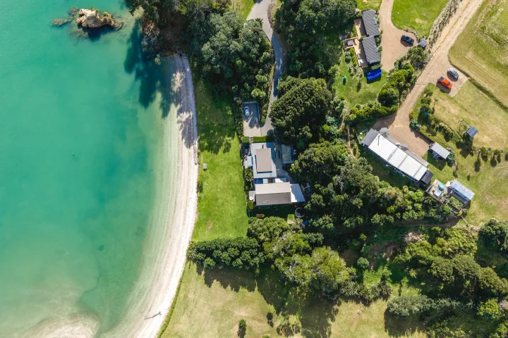 Wharetana Bay Villa Overhead show of the area showing how close the house is to the beach.
