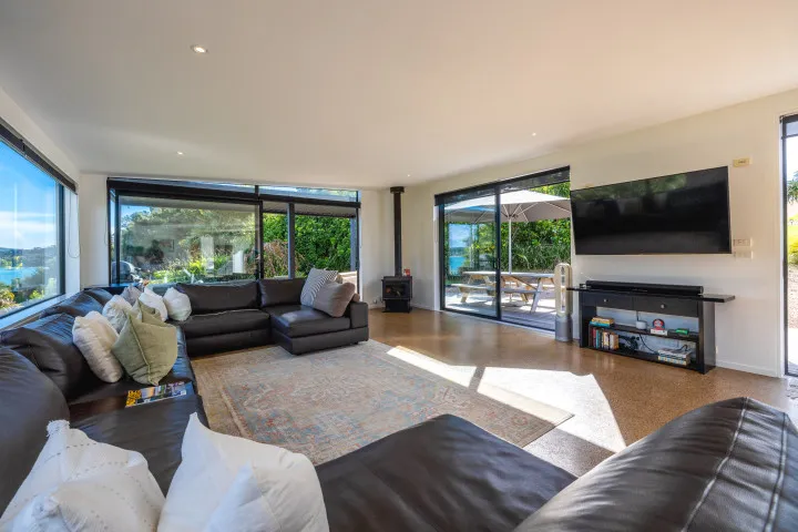 Wharetana Bay Villa large open plan lounge area with TV and sound bar